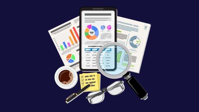 Tablet with charts, graphs, magnifying glass, and SEO audit tools like notes, glasses, and coffee cup.